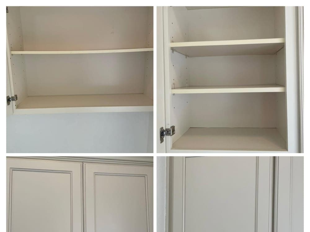 Kitchen cabinets emptied and wiped inside, doors open.