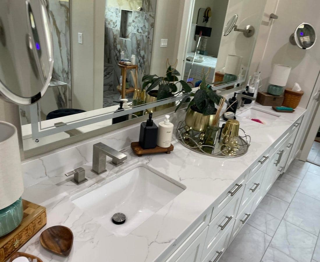 A marble bathroom vanity with the mirror and basin cleaned.